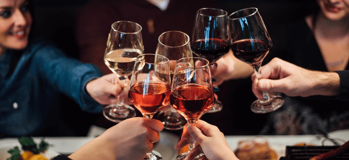 Guests raising glasses at a wine tasting